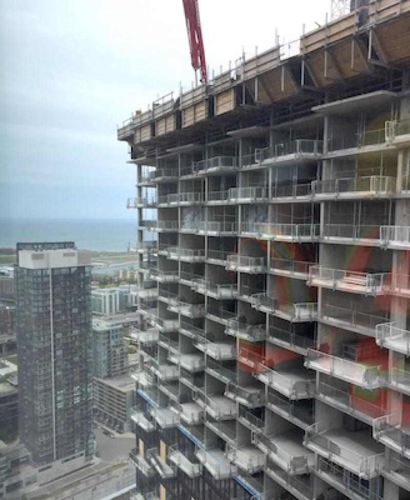 Panelists at a discussion hosted by ULI Toronto examined issues around construction costs. This image shows work being done at The Well in downtown Toronto during 2022. (RENX, Steve McLean) 