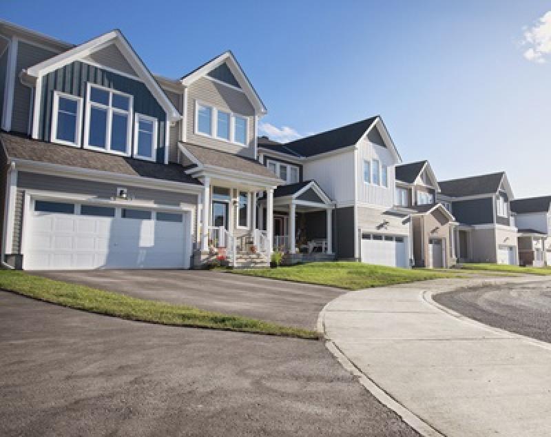 While standardization will allow for faster housing production, manufactured housing does not mean cookie-cutter design. This image shows several homes in Caivan's Fox Run subdivision in Richmond, in southwest Ottawa. (Courtesy Caivan)