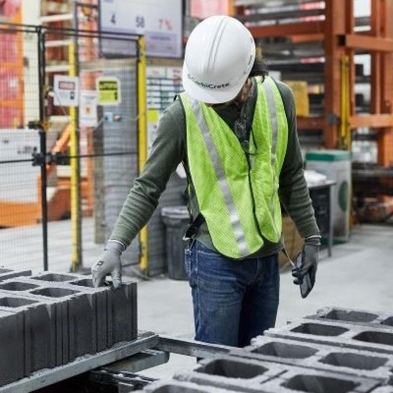 A CarbiCrete employee works with the company's concrete blocks. (Courtesy CarbiCrete)