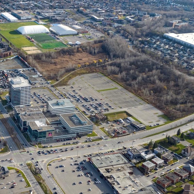 A 465,000-square-foot parking lot adjacent to the Place Laval office complex in Laval, Que., acquired by Oktodev. (Courtesy Oktodev)