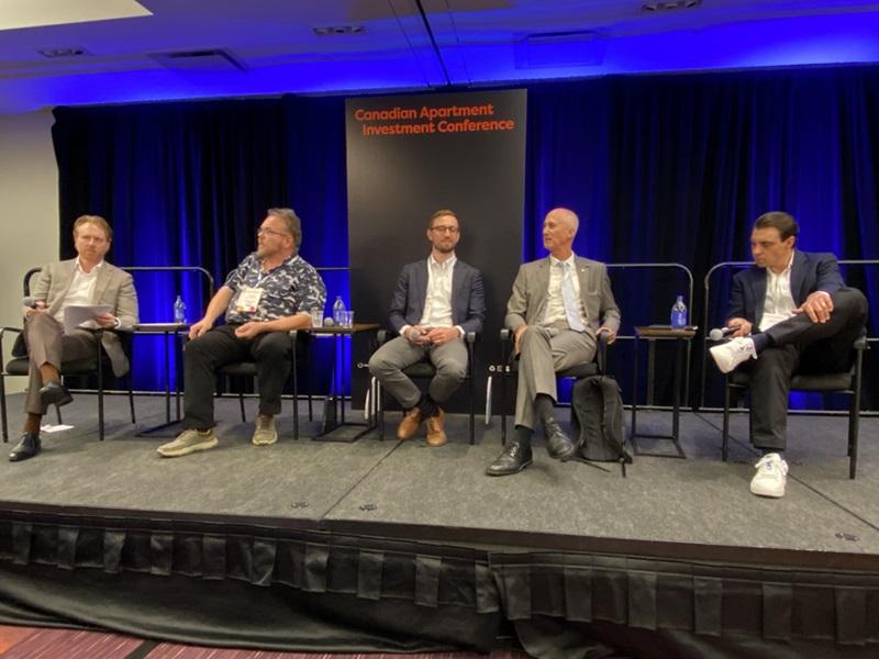 From left, members of the modular and prefab housing panel at CAIC in Toronto:  Marcus & Millichap's James Blair, The Modular Solution and The Canadian Offsite Alliance's Steven Haylestrom, Stelumar Advanced Manufacturing Inc.'s Peter Hass, Assembly Corp.'s Geoff Cape and Wesgroup Properties' Graham Brewster. (Steve McLean, RENX)