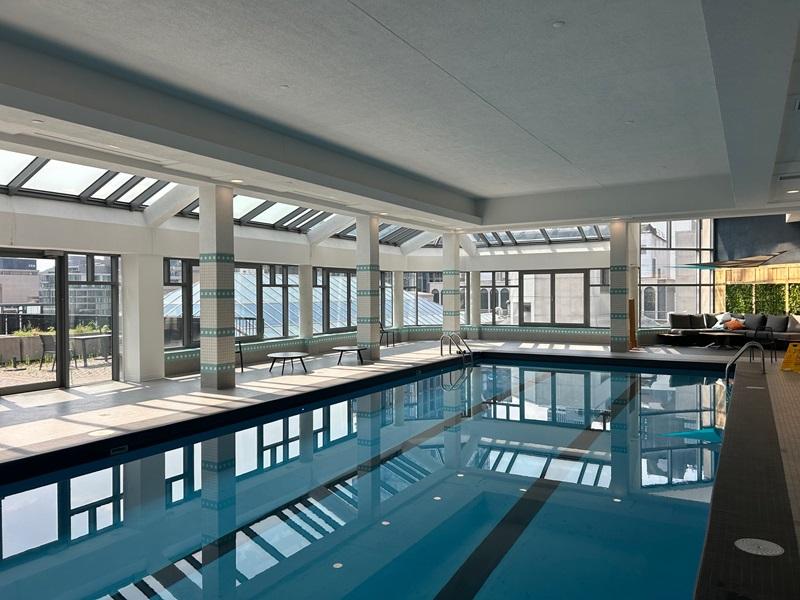 The rooftop indoor swimming pool is one of the amenities at Les Cours Mont-Royal in downtown Montreal. (Courtesy MTRPL)