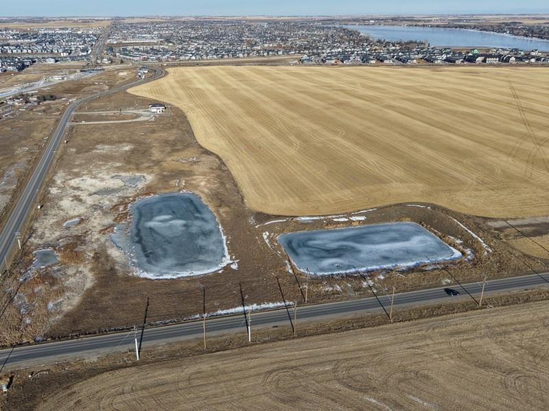 Mattamy Homes and Truman are teaming up to develop a master-planned community on this 253-acre land parcel at the southern edge of Chestermere Lake, just outside Calgary. (Courtesy Mattamy / Truman)
