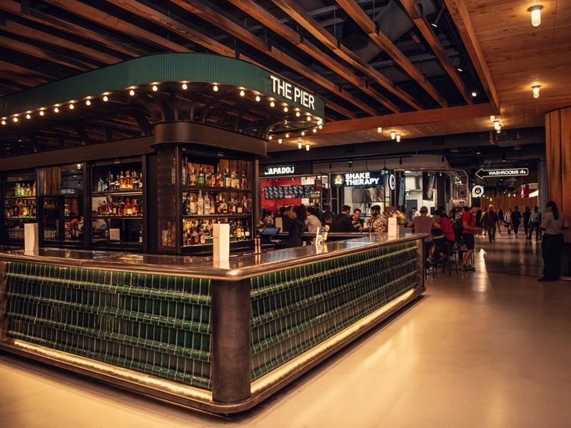 Wellington Market in The Well mixed-use property in Toronto is a good example of how the food experience can centre an asset. (Courtesy The Well website)